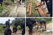 Permudah Akses Warga, Personel Kompi 2 Yon C Pelopor Brimob Kaltim Revitalisasi Jembatan di Babulu PPU